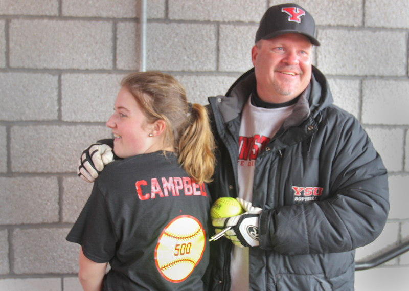 William D. Lewis The Vindicator  YSU softball coach Brian Campbell celebrates his 500th career win with his daughter Courtney, 14, after a win over NKU 4-10-18