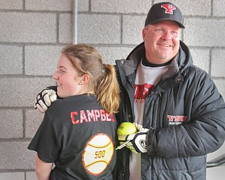 William D. Lewis The Vindicator  YSU softball coach Brian Campbell celebrates his 500th career win with his daughter Courtney, 14, after a win over NKU 4-10-18