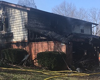 Firefighters clean up after this Hubbard home caught fire this morning.