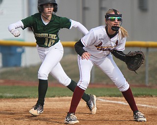 William D. Lewis The Vindicator  Ursuline's Maris Barbato(10) leads off first as Mooney 1rst baseman Lauren Frommelt(8)  waits for the throw during 4-11-18 game.