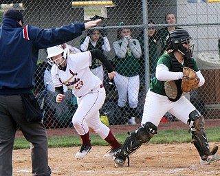 William D. Lewis The Vindicator  Mooney's Samantha Holden (23) is safe at home as Ursuline catcher Julia Nutter(17) looks to make a throw during 4-11-18 game at Fields of Dreams.