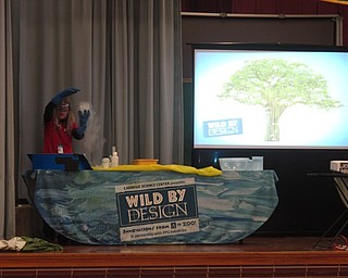 Neighbors | Zack Shively.The PTA of West Boulevard Elementary contacted and brought the Carnegie Science Center's assembly presentation to the school. Pictured, Beth Colbert demonstrated the uses of liquid nitrogen, such as utilizing it to create pressure and shoot bottles in the air.