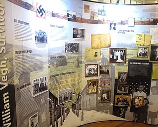 Neighbors | Zack Shively.Jesse McClain spoke at the Poland library and brought a display with him. The display showed the stories of two Holocaust survivors, Henry Kinast and Bill Vegh.