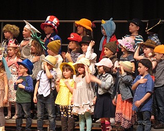 Neighbors | Zack Shively.The kindergarten's concert was centered around hats, with each student having a different hat, except one student. By the end, she got a hat and learned that the hat does not make the person.