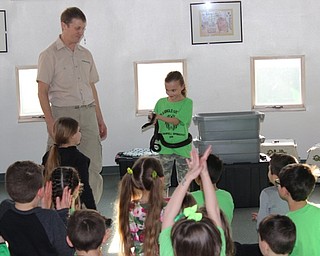 Neighbors | Abby Slanker.A C.H. Campbell Elementary School student bravely volunteered to hold a snake during a reptile and mammal show by Outback Ray during the school’s annual ‘It’s a Jungle Out There’ Spring Fest on March 16.