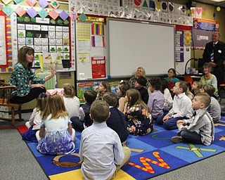 Neighbors | Abby Slanker.Hilltop Elementary School first-grade teacher Carrie Meranto (left) read “How to Babysit a Grandma” to her class and their grandparents on March 15.