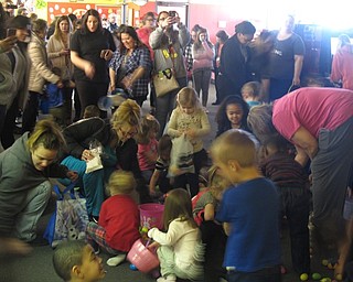 Neighbors | Zack Shively.First American Loans and Austintown Bounce set up their Easter egg hunt in three rounds for age groups 3-5, 6-9 and 10 and older. Some eggs had tokens, which could be exchanged for prize baskets.