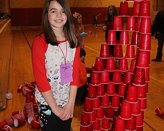 Neighbors | Abby Slanker.A Hilltop Elementary School student put her stacking skills to work as she created a very tall pyramid of cups on March 23.
