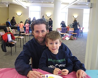 Neighbors | Zack Shively.The Poland library celebrated the spring season with their children's program "Spring Things" on March 24. The event featured a story time and a craft. Pictured are Kane Wagner and his son Dawson as they worked on a craft.