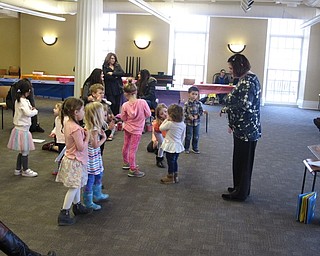 Neighbors | Zack Shively.Poland librarian Amanda Koller led a dance with the children at the library's "Spring Things" program after she read “Hurray for Spring“ by Patricia Hubbell and “Charlie Chick“ by Nick Denchfield and Ant Parker.