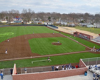 Austintown Fitch's pitcher #14, Nick Belcik, winds up for a pitch against Columbiana at the team's home opener of their new Richard L. Coppola Field in Austintown on Thursday, April 12, 2018.

Photo by Scott Williams - The Vindicator