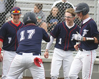 Austintown Fitch's Nick Belcik (14), right, gets congrats from NKole Klacic (7) Nick Bianco (17) and Vinny Direnzo (1) after hitting a grand slam during 4-12-18 game with Columbiana.

William D. Lewis - The Vindicator