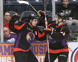 William D. Lewis The Vindicator Phantoms Eric Esposito(7), left, and Michael Joyaux(62) react after Esposito scored a goal during first period of game with Team USA game 4-12-18 at Covelli. Students from area schools visited the Covelli for a hockey game.