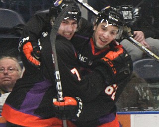 William D. Lewis The Vindicator Phantoms Eric Esposito(7), left, and Michael Joyaux(62) react after Esposito scored a goal during first period of game with Team USA game 4-12-18 at Covelli. Students from area schools visited the Covelli for a hockey game.