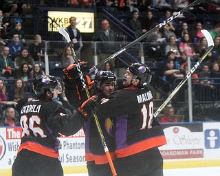 William D. Lewis The Vindicator Phantoms Eric Esposito(7), center, Nicholas Cardelli(86) and Jack Malone(18) react after Esposito scored a goal during first period of game with Team USA game 4-12-18 at Covelli. Students from area schools visited the Covelli for a hockey game.