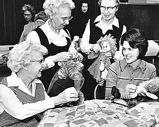 HOMESPUN HAPPENING - Bicentennial crafts, like these being worked by Mrs. Eloise Rupert and Mrs. Daniel Altsman (seated, left to right) and Elanor Davis and Marion Maiden (left to right, standing) will be available at First Presbyterian Church's bazaar and luncheon at the church from 10 a.m. to 4 p.m. Thursday.

Photo by Paul R. Schell.