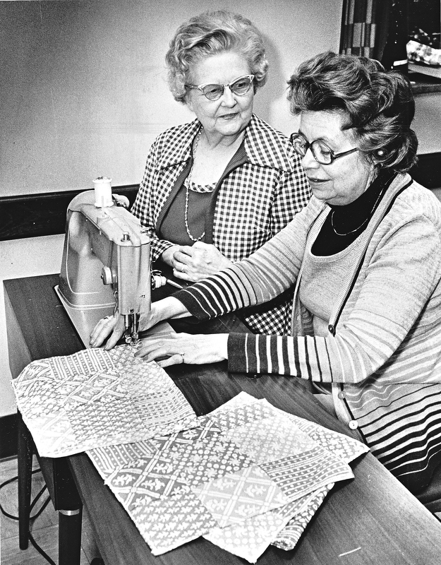 STITCH IN TIME - Mrs. Edward Reese (left) and Marietta Bagnall are working on patchwork napkins for the bazaar.  Reservations are needed for the luncheon from 11 a.m. to 2 p.m.  A sandwich bar will be available for those who do not want a full course meal.

Photo by Paul R. Schell.