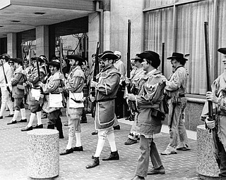 RE-ENACT START OF AMERICAN REVOLUTION AT FEDERAL PLAZA - Ready of the British advance, thanks to Revere's prompt response to pre-arranged lantern signals, were the colonial minutemen, waiting at Concord.  An earlier skirmish killed eight Americans and wounded 10 others at Lexington.  Few recall that William Dawes was with Revere on that midnight ride of that 93 Americans fell at Lexington along with 273 Redcoats.  Members of the Mahoning Valley Colonial Brigade reenacted the scene, captured Vindicator Photographer Lloyd S. Jones.