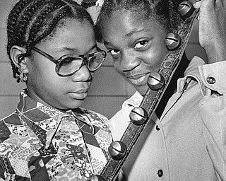 Jingle bells from a horse harness of yester-year ring their pleasant peal for Voncile Judge (left) and Viola Penson.

Photo published Saturday, November 1, 1975.

Photo by Paul R. Schell.