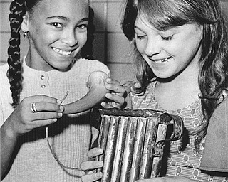 Inspecting a powder horn and candle molds from a past era are Pamela Jackson (left) and Tina Lilley.

Photo published Saturday, November 1, 1975.

Photo by Paul R. Schell.