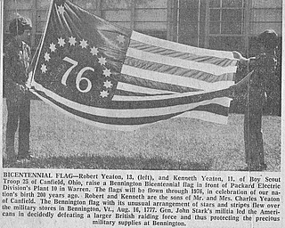 BICENTENNIAL FLAG - Robert Yeaton, 13, (left), and Kenneth Yeaton, 11, of Boy Scout Troop 25 of Canfield, Ohio, raise a Bennington Bicentennial flag in front of Packard Electric Division's Plant 10 in Warren.  The flags will be flown through 1976, in celebration of our nation's birth 200 years ago.  Robert and Kenneth are the sons of Mr. and Mrs. Charles Yeaton of Canfield.  The Bennington flag with its unusual arrangement of stars and stripes flew over the military stores in Bennington, Vt., Aug. 16, 1777.  Gen. John Stark's militia led the Americans in decidedly defeating a larger British raiding force and thus protecting the precious military supplies at Bennington.

Photo published June 20, 1975.