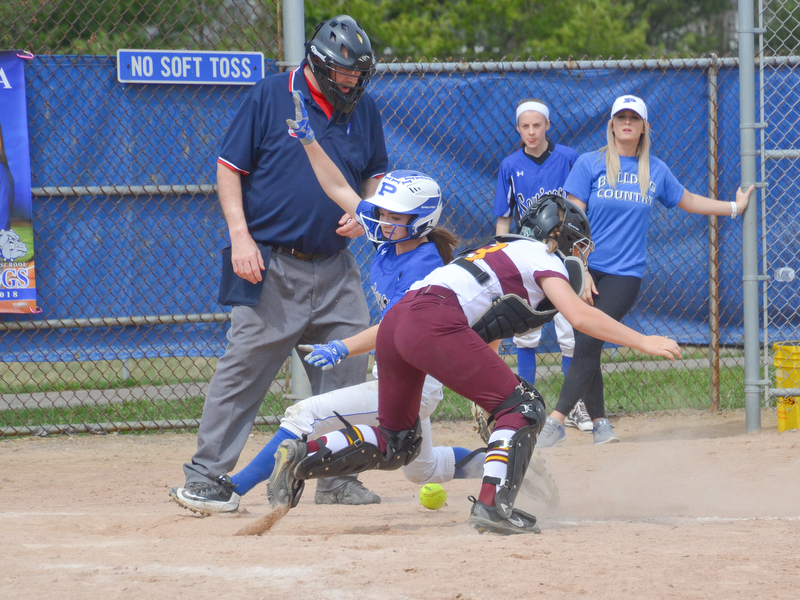 Safe by a mile - Poland Seminary's #1, Brooke Bobbey, is safe at home after South Range's #23, Jillian Strecansky, misses the throw home during their game in Poland on Saturday, April 14, 2018.

Photo by Scott Williams - The Vindicator