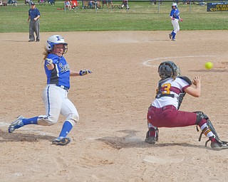 Poland Seminary's #7, Payton Slaina, is safe at home, but just barely, after beating the tag by South Range's catcher #23, Jillian Strecansky, during their game in Poland on Saturday, April 14, 2018.

Photo by Scott Williams - The Vindicator