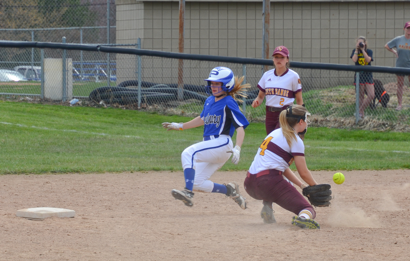 Poland Seminary's #9, Ashley Wire, has successfully stolen second base before South Range's #4, Abbey Bokros, could apply the tag during the game in Poland on Saturday, April 14, 2018.

Photo by Scott Williams - The Vindicator