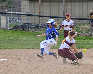 Poland Seminary's #9, Ashley Wire, has successfully stolen second base before South Range's #4, Abbey Bokros, could apply the tag during the game in Poland on Saturday, April 14, 2018.

Photo by Scott Williams - The Vindicator