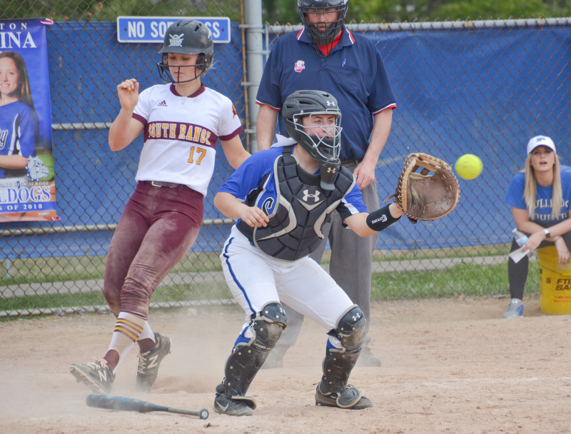 South Range's #17, Bree Kohler, crosses home plate before Poland Seminary's #2, Camryn Lattanzio, can apply the tag during their game in Poland on Saturday, April 14, 2018.

Photo by Scott Williams - The Vindicator