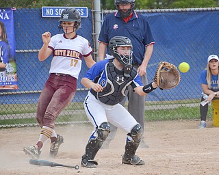 South Range's #17, Bree Kohler, crosses home plate before Poland Seminary's #2, Camryn Lattanzio, can apply the tag during their game in Poland on Saturday, April 14, 2018.

Photo by Scott Williams - The Vindicator