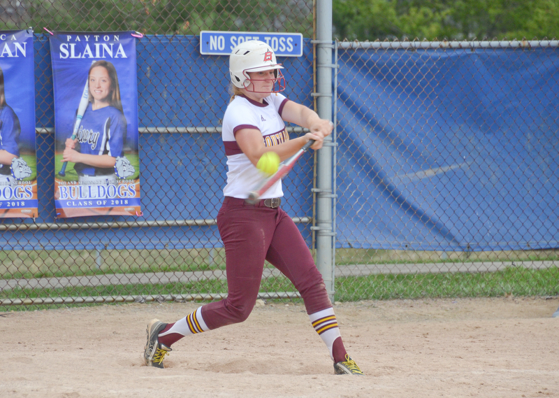 South Range's #8, Madison Weaver, makes contact to earn herself a base hit during their game against Poland in Poland on Saturday, April 14, 2018.

Photo by Scott Williams - The Vindicator