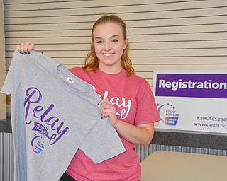 Megan Crees, a YSU Junior, communications major, proudly displays a Relay for Life 2018 tee-shirt given to those who raised more than $100 for the fight against cancer at Relay for Life at Beeghly Center on the campus of Youngstown State University on Saturday April 14, 2018.

Photo by Scott Williams - The Vindicator