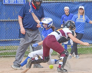 Poland baserunner Brooke Bobbey scores as South Range catcher Jillian Strecansky retrieves the ball during Saturday’s game in Poland. The Bulldogs rallied for a 12-8 victory.