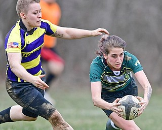 Allegheny’s Hannah Hall, right, lunges for the end zone to score as Indiana’s Amy Hale gives chase during a rugby match Saturday at Bailey Park. Allegheny won, 61-0.