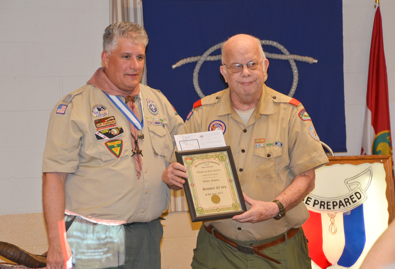 Kurt Hilderbrand, left, presents Walter Fowles with a 60 years of service award at the Whispering Pines Boy Scouts Recognition Dinner at St. James Episcopal Church in Boardman on Sunday, April 15, 2018.

Photo by Scott Williams - The Vindicator