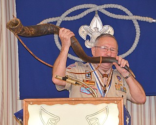 Bill Moss, district training chairman, blows the Kudu horn to begin the Wood Badge Ceremony at the Whispering Pines Recognition Dinner at St. James Episcopal Church in Boardman on Sunday, April 15, 2018.

Photo by Scott Williams - The Vindicator