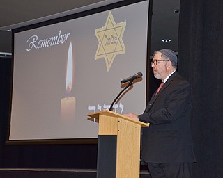 Rabbi Joseph Schonberger welcomes guests to the Shoah Memorial Ceremony held at the Jewish Community Center on Sunday, April 15, 2018.

Photo by Scott Williams - The Vindicator