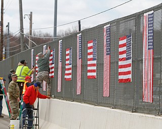 The Mahoning County Veterans Service was busy putting up flags over one of several bridges in Mahoning County. Three bridges are slated to get the flags. They are the state Route 46 overpass in Austintown over interstates 80 and 76; Mahoning Avenue over state Route 11 and state Route 164.