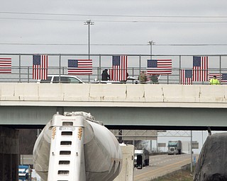 The Mahoning County Veterans Service hung flags over one of three bridges in Mahoning County. The three bridges are the state Route 46 overpass in Austintown over interstates 80 and 76; Mahoning Avenue over state Route 11 and state Route 164.




