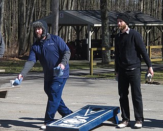 Neighbors | Zack Shively.The Rotary combined the money raised during their Night at the Races event and their Chili Open and will allocate the funds to 16 local charities. Pictured, two Rotary members compete in the cornhole tournament during the Chili Open.