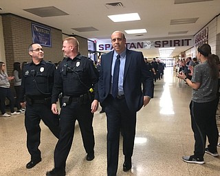 Neighbors | Submitted .On March 14 at Boardman High School,  more than 40 Boardman police, fire and paramedics were honored in the Spartan Clap Out. Pictured are School Resource Officers Chuck Hillman and Paul Poulos with Chief Todd Werth.