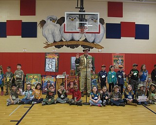 Neighbors | Zack Shively.Tim Smith, author of the "Buck Wilder" series of children's books, visited Austintown Elementary School on March 16 for an assembly for each of the three grade levels. Pictured, he stood with first-grade students in front of his presentation display.