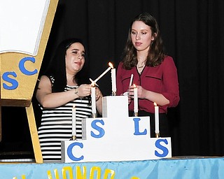 Neighbors | Submitted .At the Poland Seminary High School National Honor Society Induction Ceremony, Rachel Mowad (member) and Monica Kurjan (Vice President), lit candles to pass on to new inductees.