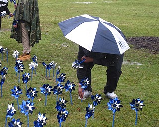 Neighbors | Zack Shively.Akron Children’s Hospital Mahoning Valley’s Child Advocacy Center and Mahoning County Children Services planted the pinwheels in the yard to raise awareness of child abuse and neglect during National Child Abuse and Neglect Prevention Month.