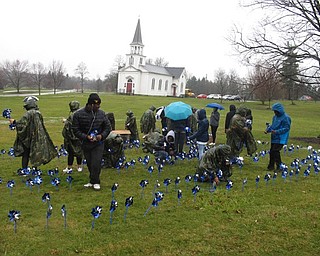 Neighbors | Zack Shively.Mahoning County Children Services and Akron Children’s Hospital Mahoning Valley’s Child Advocacy Center have organized the pinwheel planting for 13 years. Of those 13, East High School's Junior ROTC program has helped for seven years.