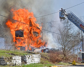 Around 3:30pm on Friday, April 20, 2018, the Youngstown Fire Department was called to a vacant structure fire at 463 South Forest Avenue in Youngstown.  Crews let it burn and focused mostly on keeping it contained, as it caught the yard on fire.  

Photos by Scott Williams - The Vindicator