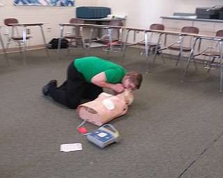 The students in Gary Martin’s health classes at West Branch High School were given the chance recently to learn the proper techniques of performing first aid as well as learning how to administer cardio-pulmonary resuscitation. The HeartSaver first aid/CPR course provided the students the opportunity to become certified in CPR through the American Heart Association. Additionally, students learned what signs to look for in case of an emergency. Above, Joe Sprague, freshman, practices CPR during health class.
