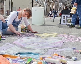 Rachel Hritz, 18, from Boardman, signed up to do "live art," making a chalk drawing of Prince, at the Federal Frenzy Music and Arts Festival on West Federal Street in downtown Youngstown on Saturday, April 21, 2018.  

Photo by Scott R. Williams - The Vindicator 