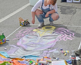 Rachel Hritz, 18, from Boardman, signed up to do "live art," making a chalk drawing of Prince, at the Federal Frenzy Music and Arts Festival on West Federal Street in downtown Youngstown on Saturday, April 21, 2018.  

Photo by Scott R. Williams - The Vindicator